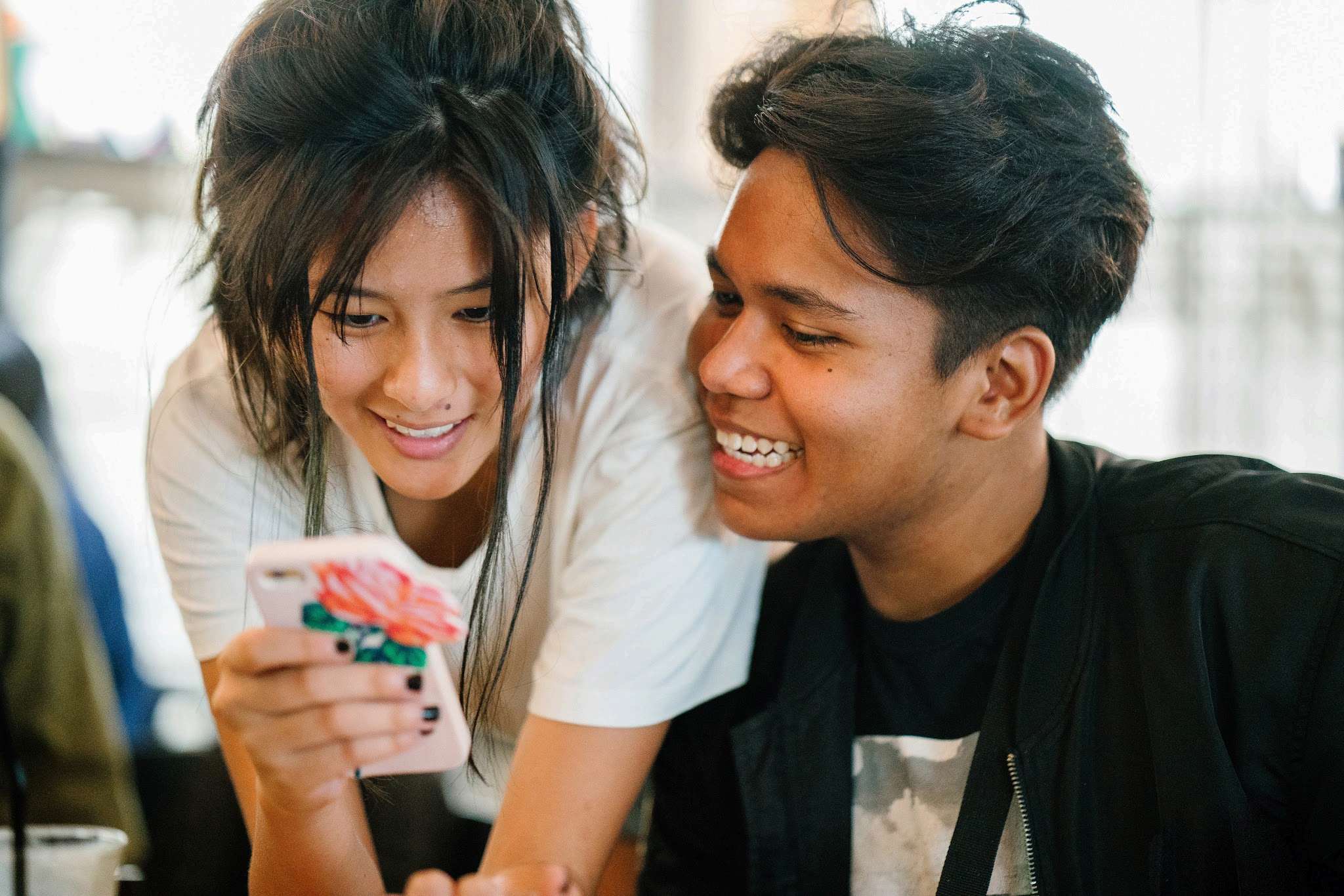 People discovering an experience together on a phone